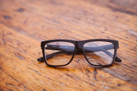 Eyeglasses on a wooden surface