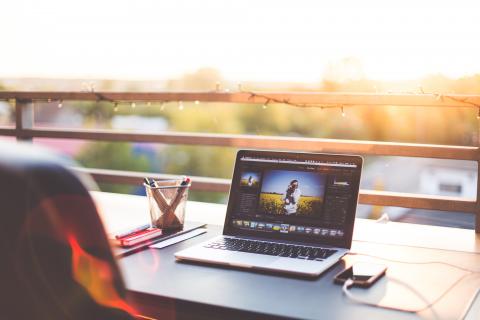 Laptop on a desk with a view