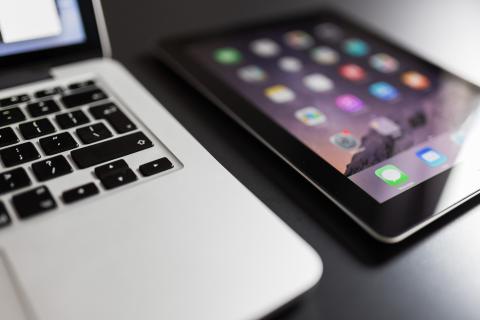 Close up of laptop and mobile device on a desk