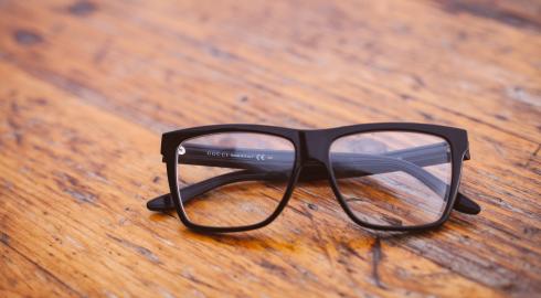 Eyeglasses on a wooden surface