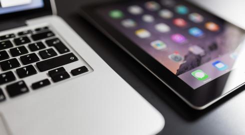 Close up of laptop and mobile device on a desk